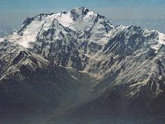 
On the 40-minute flight from Islamabad to Skardu, the captain announces, We'll be flying at a planned altitude of 8,000 metres. Perfect I thought, we'll be exactly at the height of Nanga Parbat. The flight starts low key with the stewardesses serving drinks while we bide our time. When the pilot announces Nanga Parbat is immediately ahead on the right, all hell breaks loose. As one, all the tourists, including me, are up in the aisles, craning their necks, running for the cockpit. The sounds of cameras are everywhere. There it is, within arms reach. Nanga Parbat in perfect early morning splendor! We are passing by the Diamir Face, as I click photo after photo. The massive Mazeno Ridge runs down to the right of Nanga Parbat. The Mazeno ridge is the longest ridge on any 8000m mountain and includes eight 7000m peaks. Nobody has managed to traverse the ridge and continue to the summit of Nanga Parbat.
